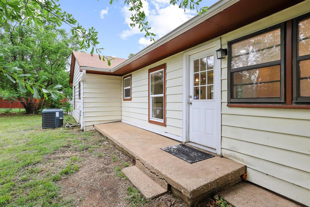 2401 Sunset Street Denison, TX 75020 - Photo 27 of 30 a backyard of a house with seating space