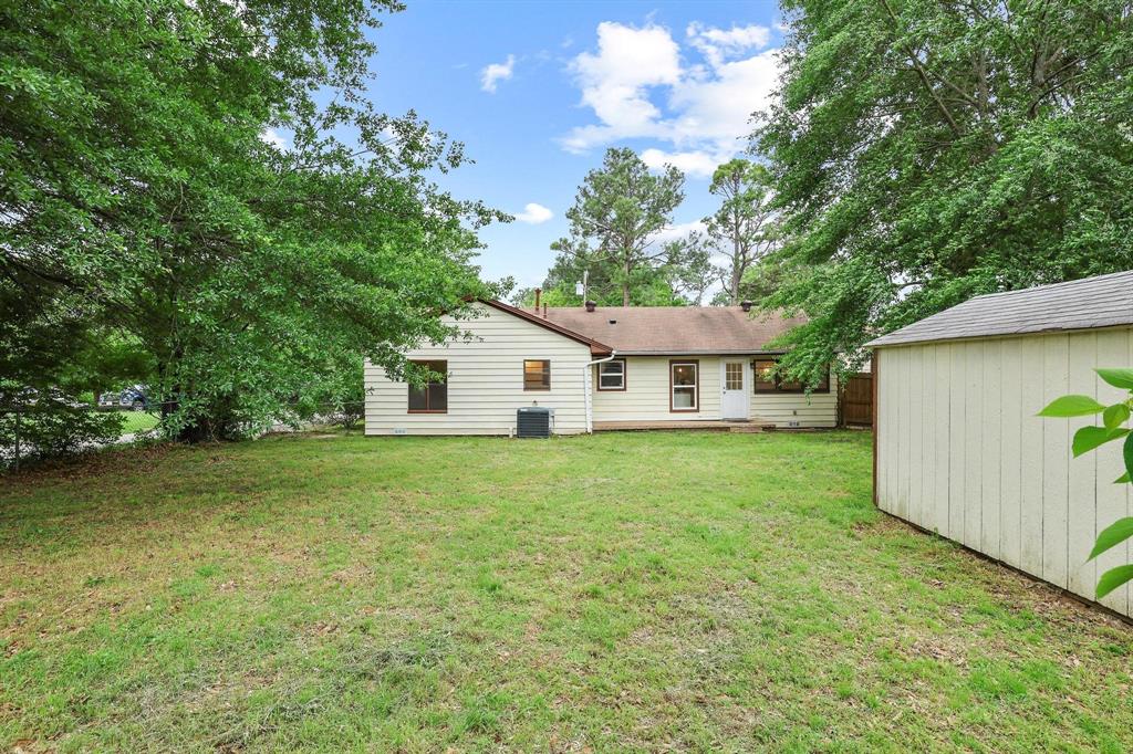 2401 Sunset Street Denison, TX 75020 - Photo 29 of 30 a view of a house with backyard and garden