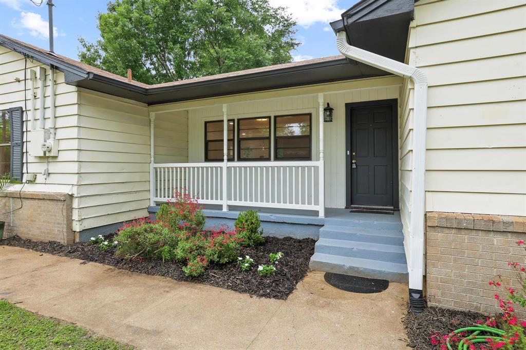 2401 Sunset Street Denison, TX 75020 - Photo 4 of 30 a front view of a house with garden