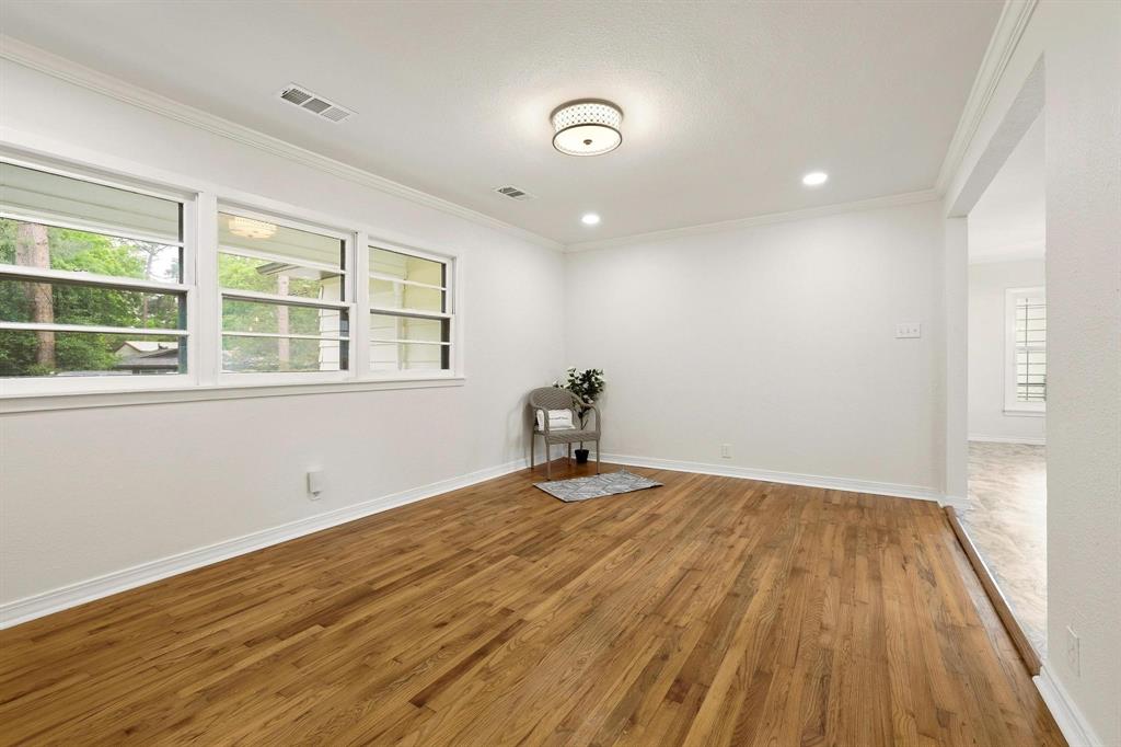 2401 Sunset Street Denison, TX 75020 - Photo 7 of 30 a view of empty room with wooden floor and fan