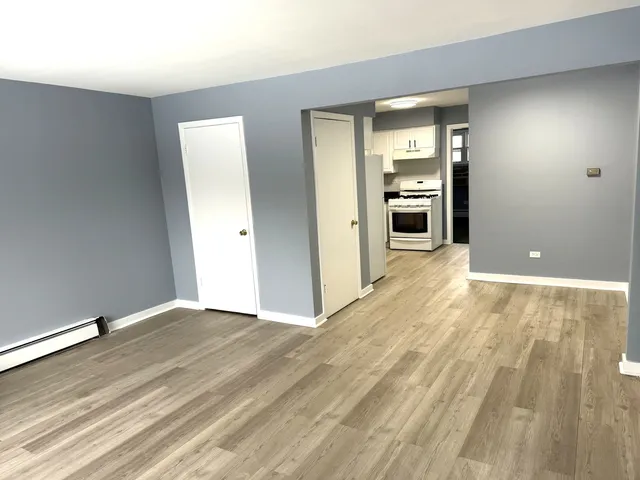 a kitchen with stainless steel appliances a refrigerator sink and cabinets