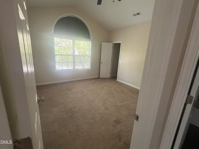 a bathroom with a double vanity sink and a toilet