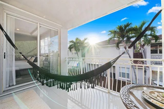 a view of staircase with wooden floor and a potted plant