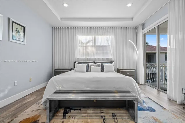 a bedroom with a bed and glass window