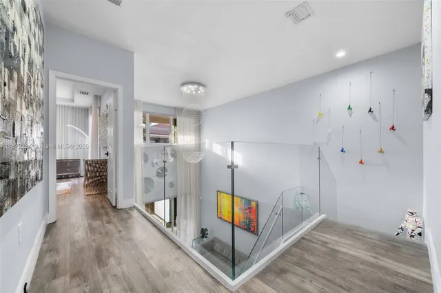 a view of an entryway with wooden floor