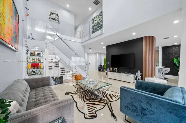 a living room with furniture and a flat screen tv