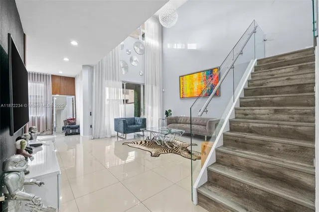 a lobby with furniture and stairs