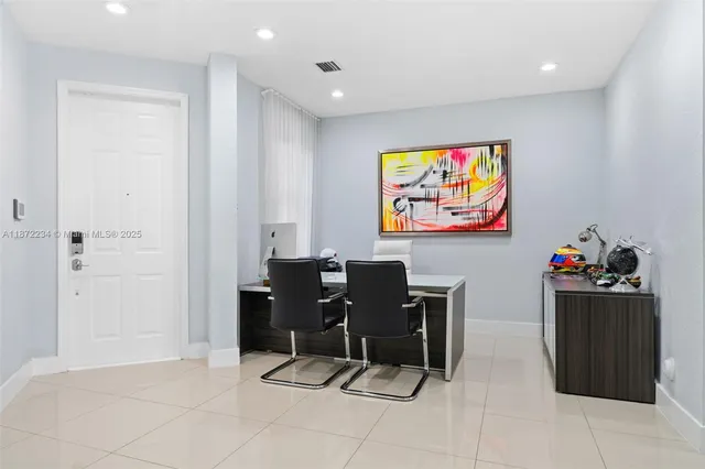 a view of a workspace with furniture