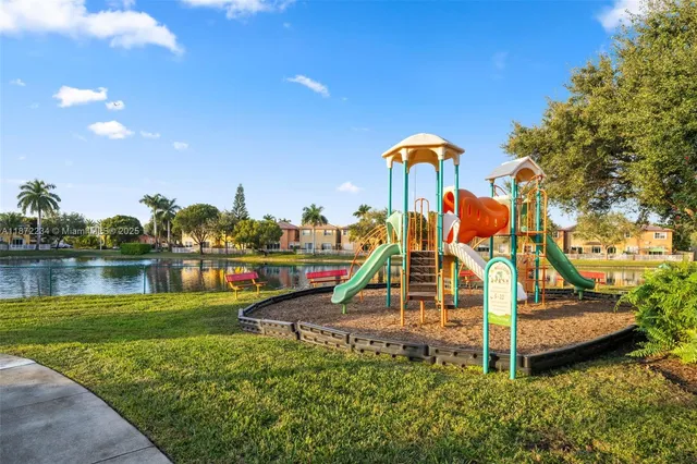 a view of a park with swings and slides