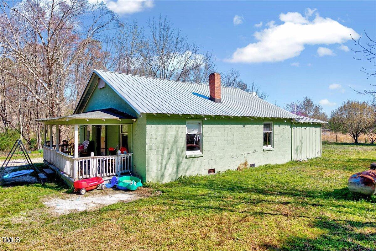 290 Collie Road Castalia, NC 27816 - Photo 46 of 61 a front view of a house with garden