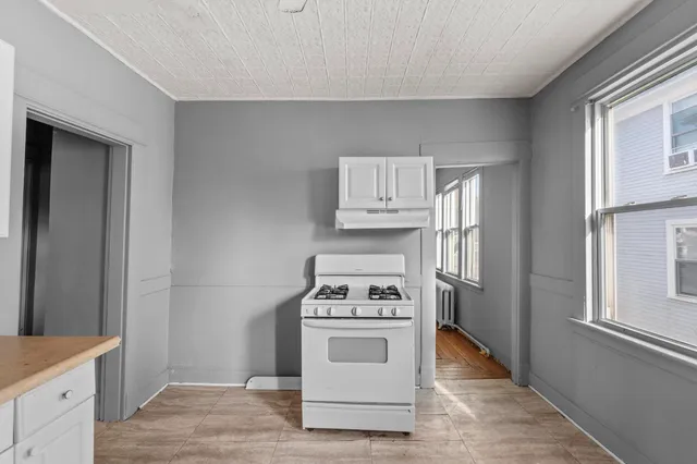 a kitchen with a stove and a microwave