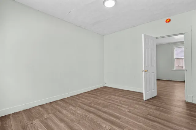 a view of wooden floor in an empty room