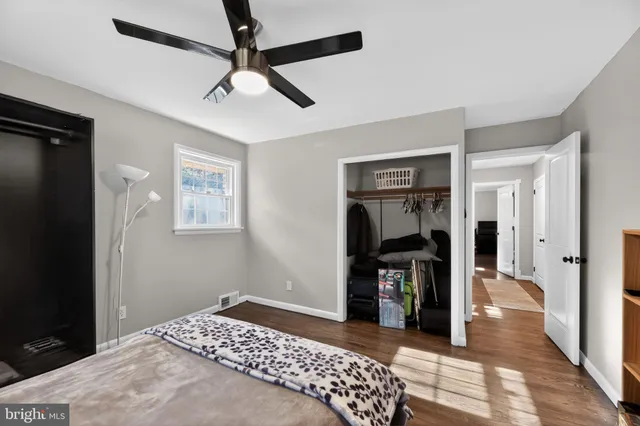 a bedroom with a bed and a walk in closet