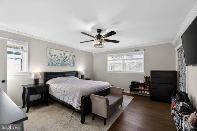 a bedroom with a bed furniture and a window