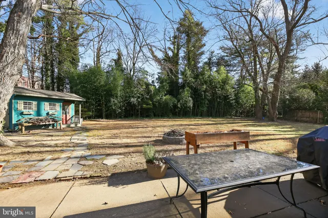 a view of house with swimming pool and sitting area