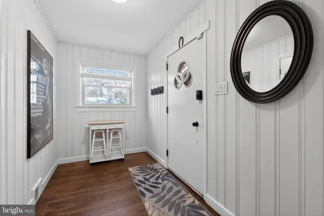 a view of a hallway with washer and dryer