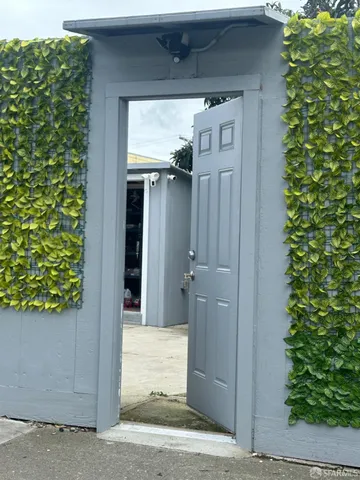 a view of a wooden door of the house