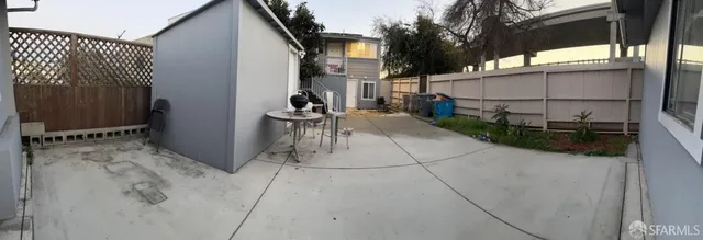 a view of yard with patio