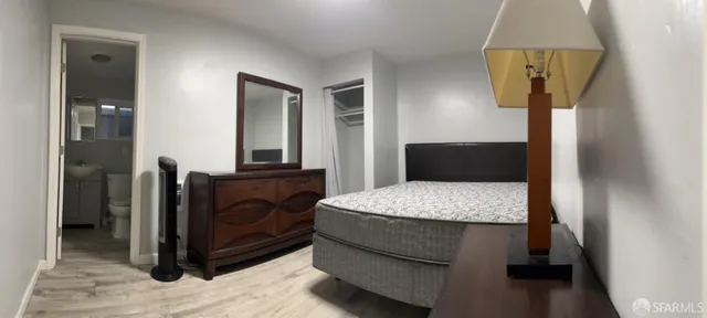 a bedroom with a bed and window