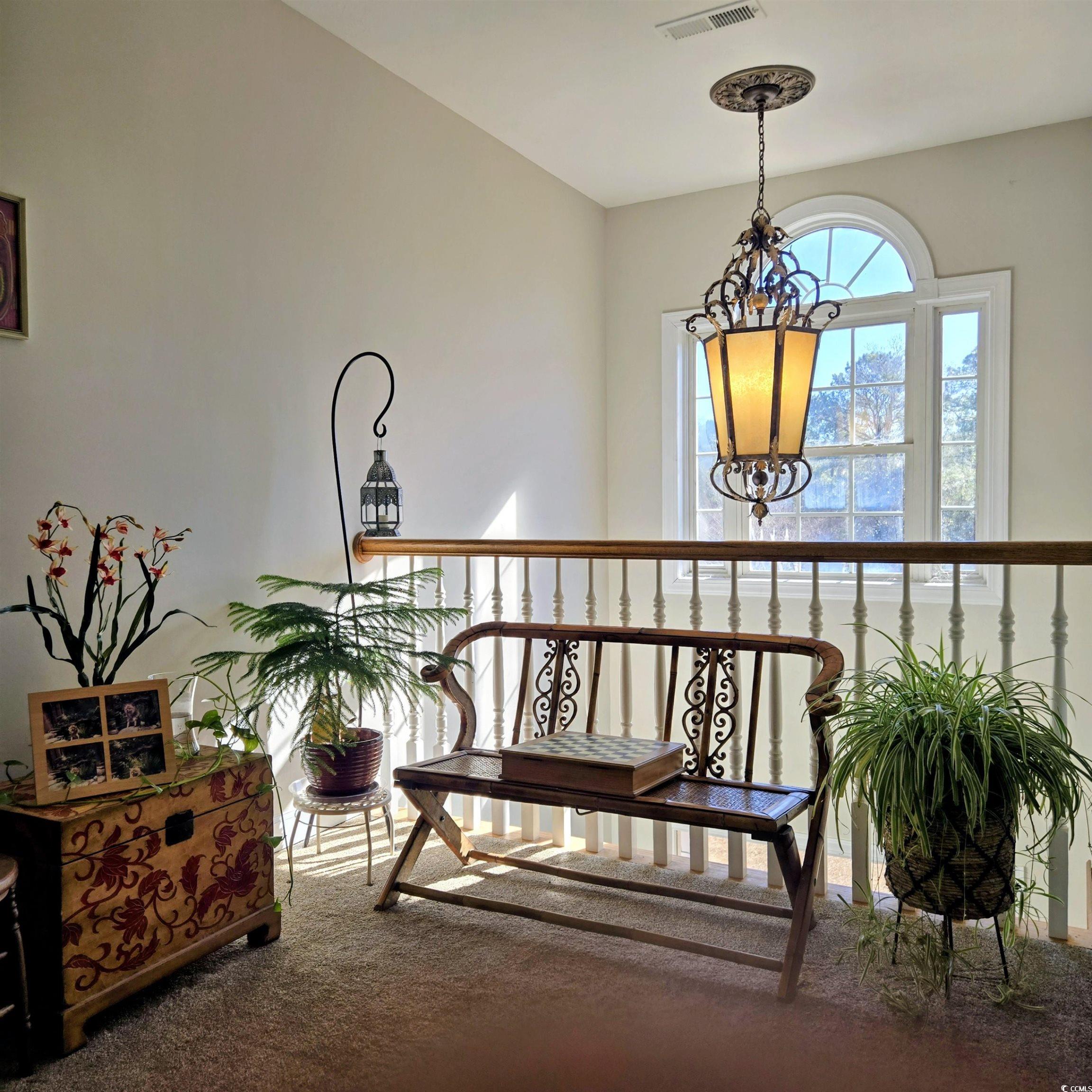 2410 Hunters Trail Myrtle Beach, SC 29588 - Photo 23 of 35 Sitting room featuring a chandelier and carpet floors