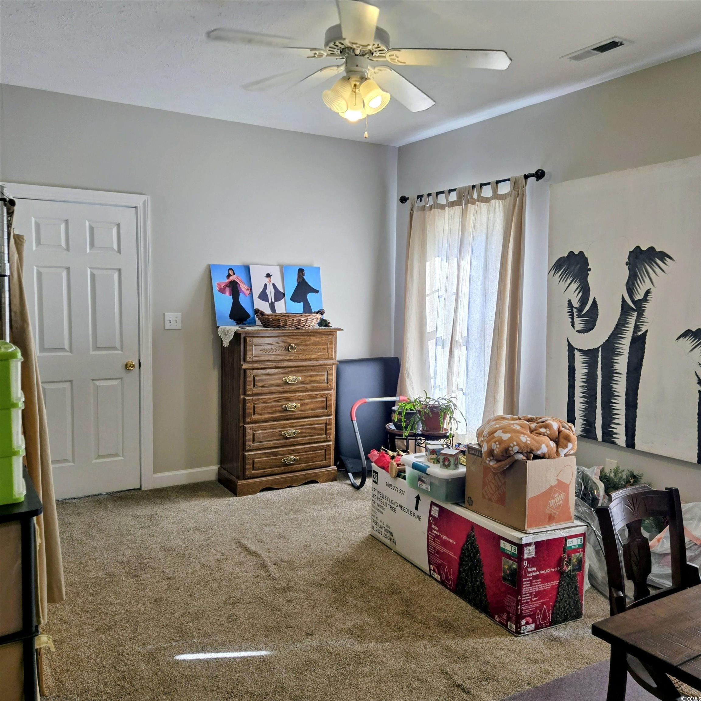 2410 Hunters Trail Myrtle Beach, SC 29588 - Photo 24 of 35 Bedroom featuring carpet and a ceiling fan