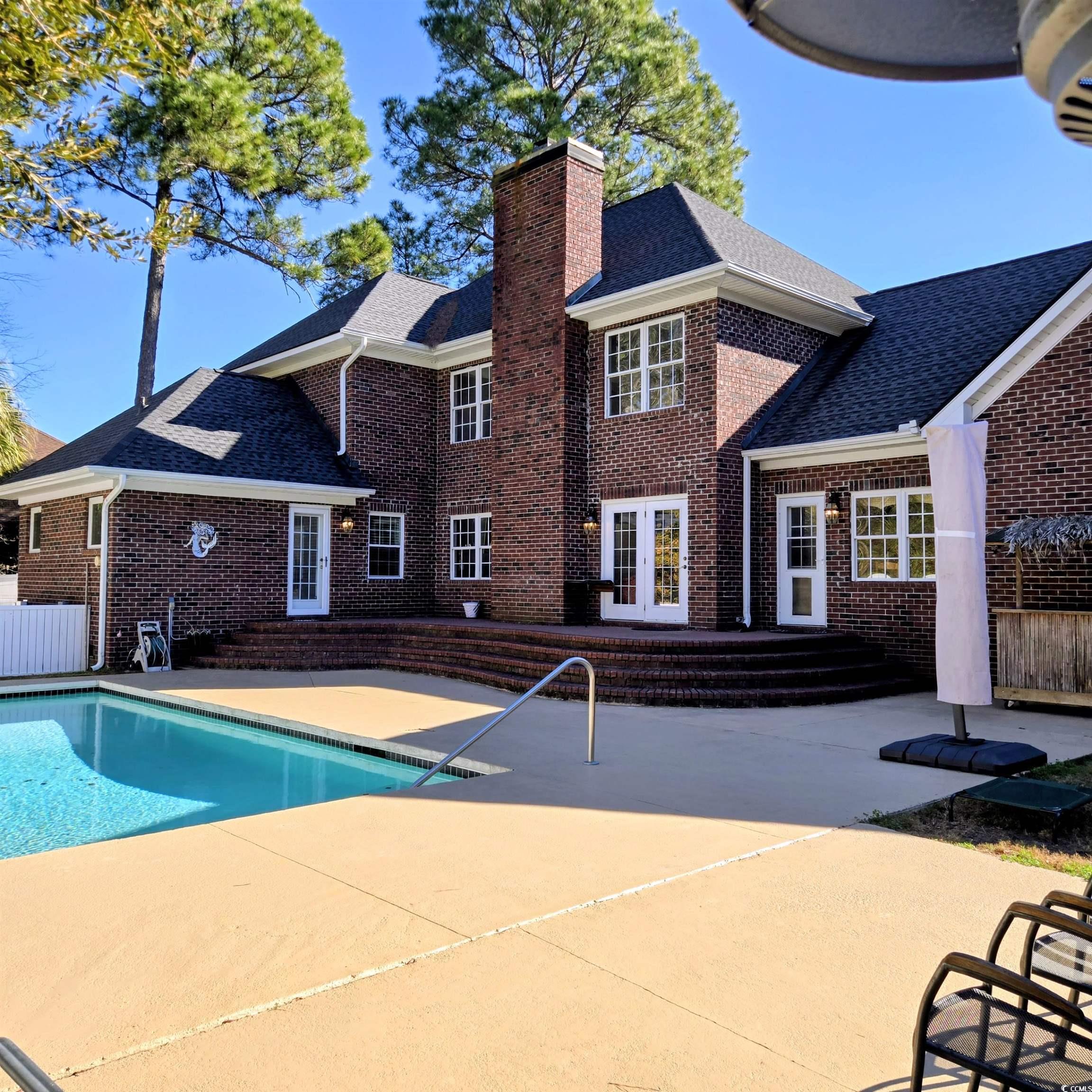 2410 Hunters Trail Myrtle Beach, SC 29588 - Photo 27 of 35 Swimming pool featuring a patio and french doors