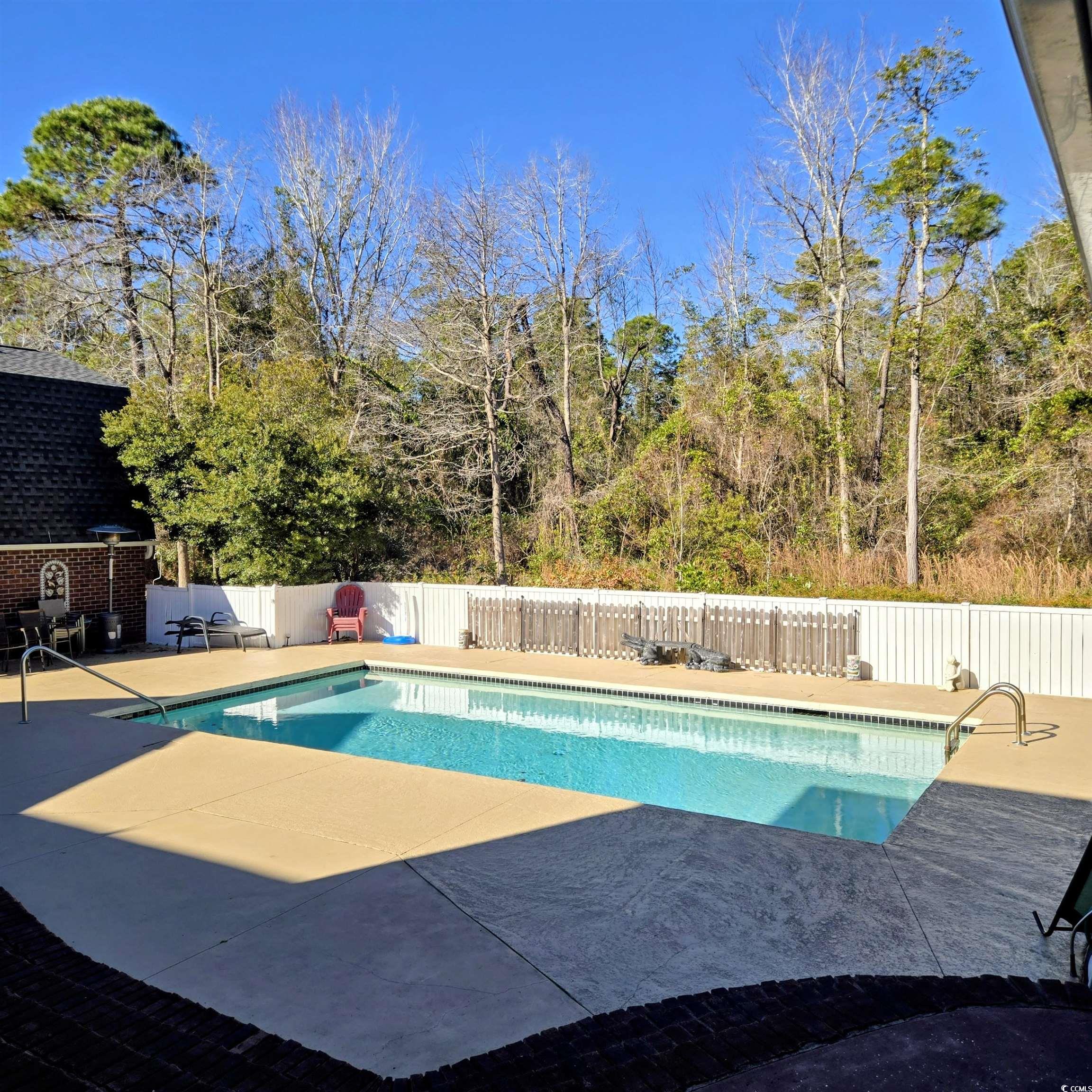 2410 Hunters Trail Myrtle Beach, SC 29588 - Photo 30 of 35 View of pool with a patio and a fenced backyard