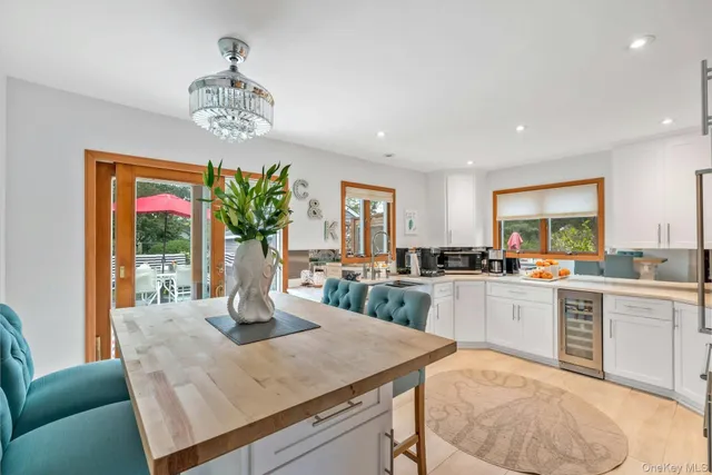 a kitchen with a table chairs and stove