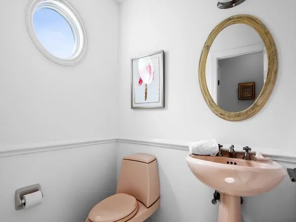 a bathroom with a toilet and a sink