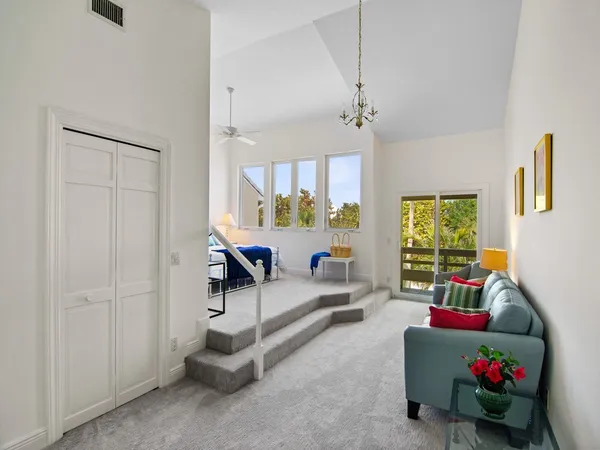 a bedroom with furniture and a window