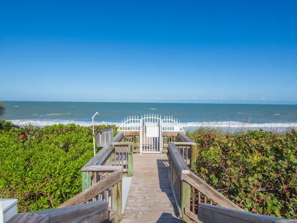 a view of a balcony with an ocean view