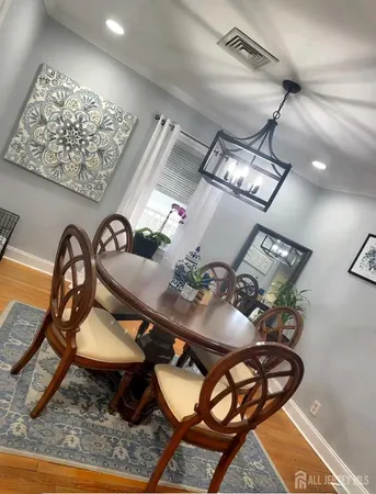 a table room with furniture and painting on the wall