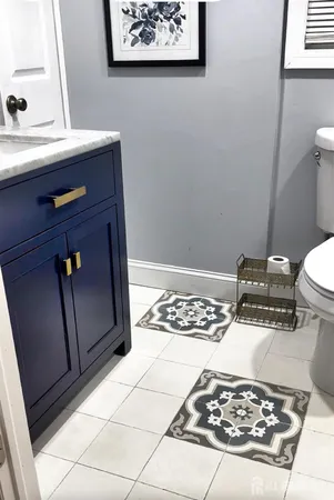 a bathroom with a black white stove