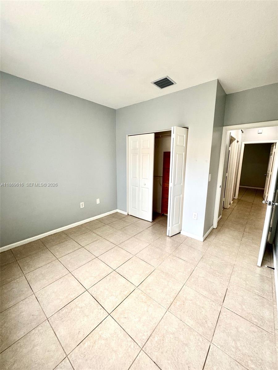 4402 Southwest 160th Avenue, Unit 910 Miramar, FL 33027 - Photo 12 of 22 a view of a livingroom with an empty space and a sink