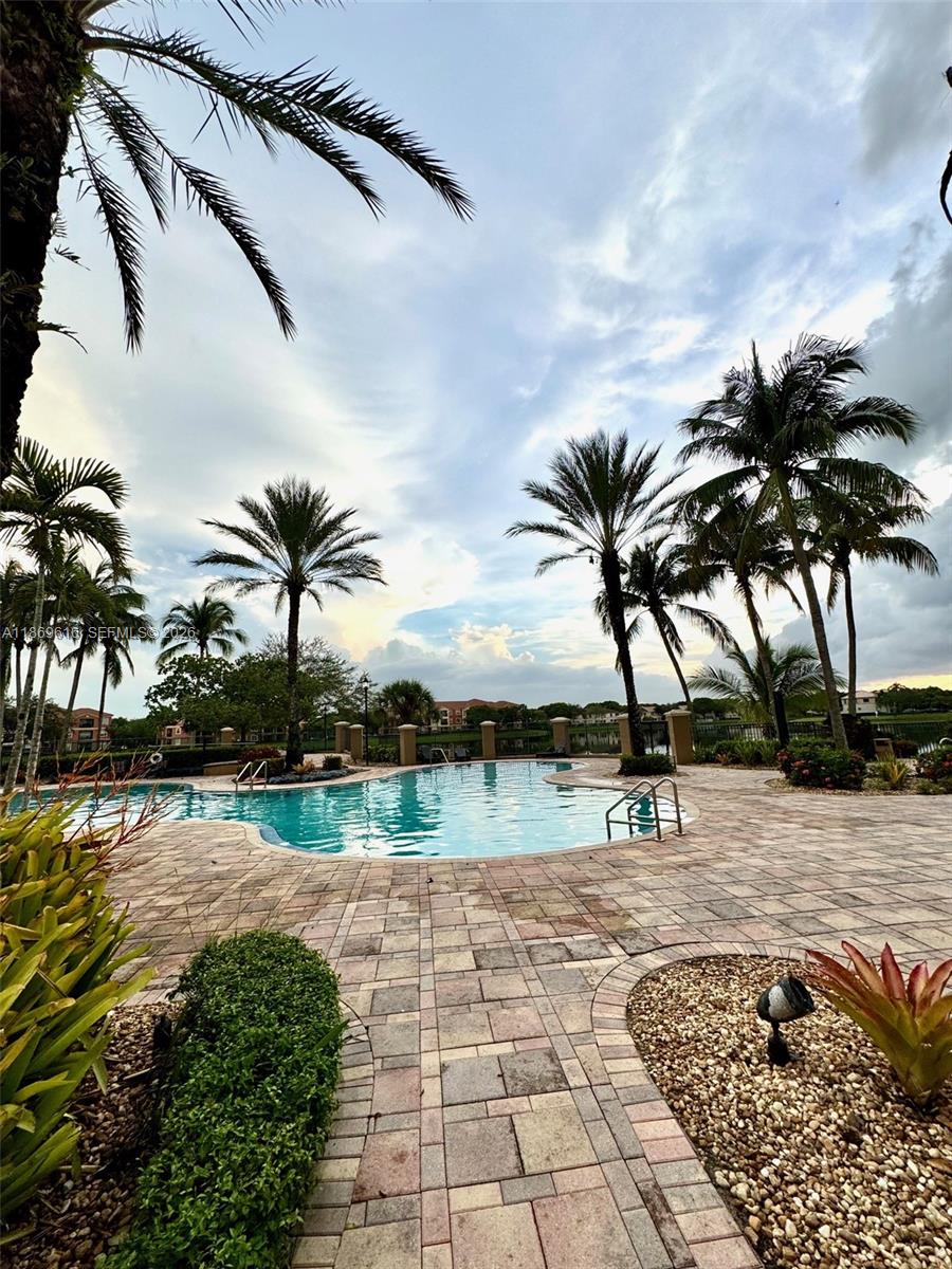 4402 Southwest 160th Avenue, Unit 910 Miramar, FL 33027 - Photo 20 of 22 a view of a backyard