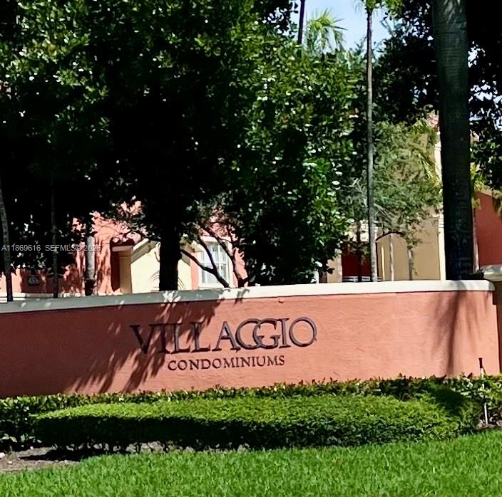 4402 Southwest 160th Avenue, Unit 910 Miramar, FL 33027 - Photo 2 of 22 a view of outdoor space with sign board and garden