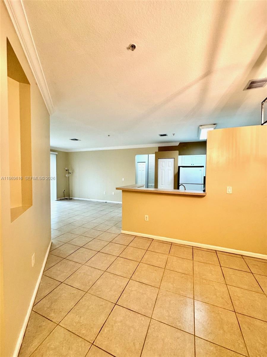 4402 Southwest 160th Avenue, Unit 910 Miramar, FL 33027 - Photo 3 of 22 a view of an empty room