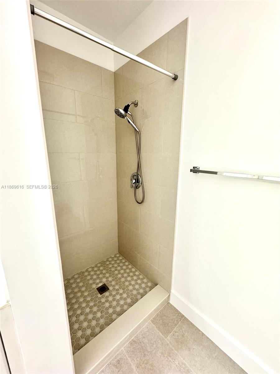 4402 Southwest 160th Avenue, Unit 910 Miramar, FL 33027 - Photo 10 of 22 a bathroom with a shower