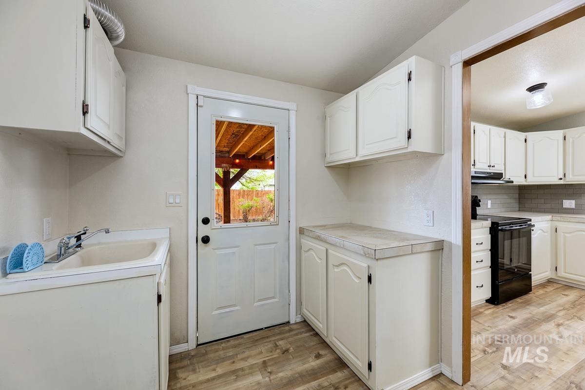 10131 Highway 44 Middleton, ID 83644 - Photo 17 of 42 Laundry room featuring light wood-type flooring