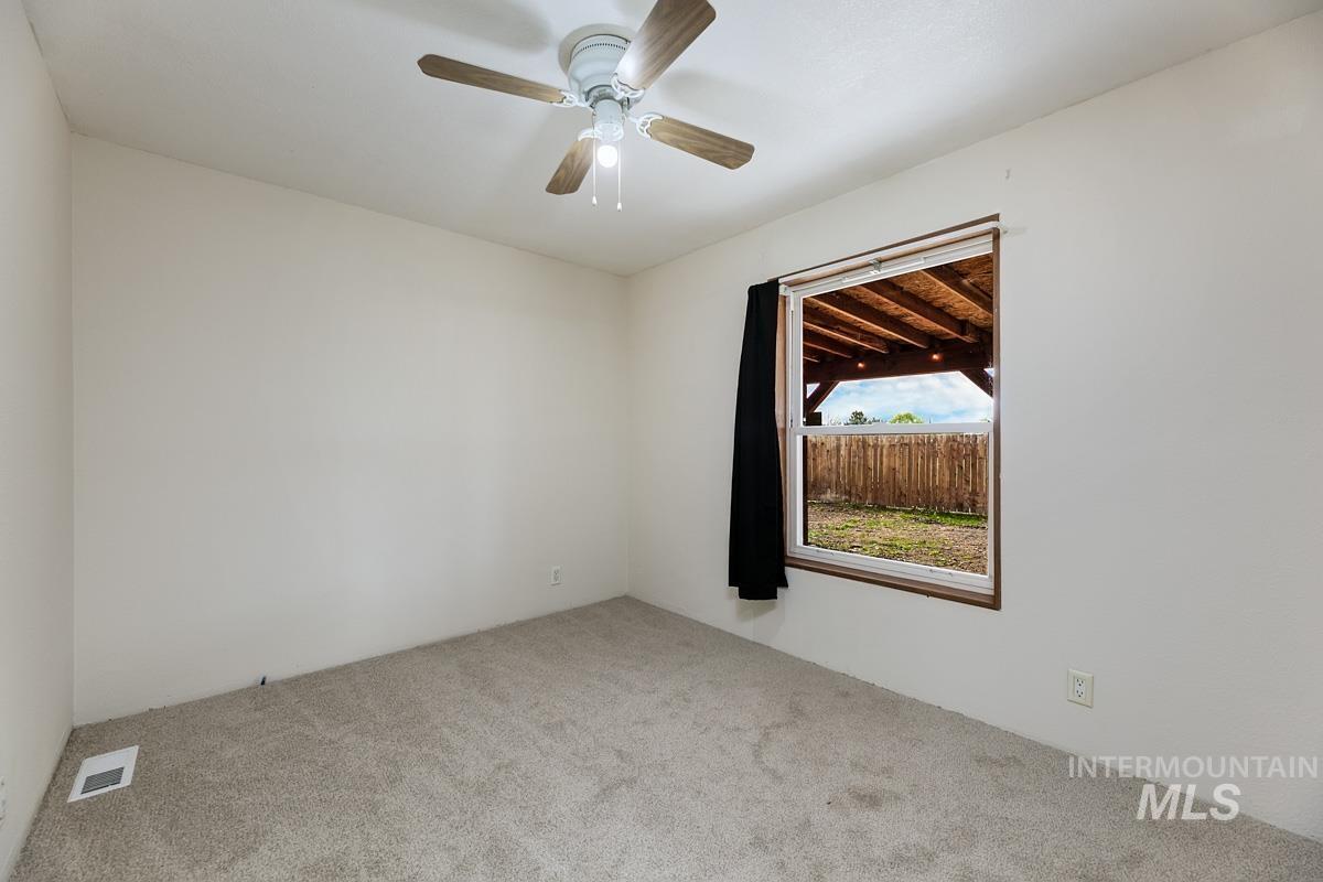 10131 Highway 44 Middleton, ID 83644 - Photo 18 of 42 Carpeted spare room with ceiling fan