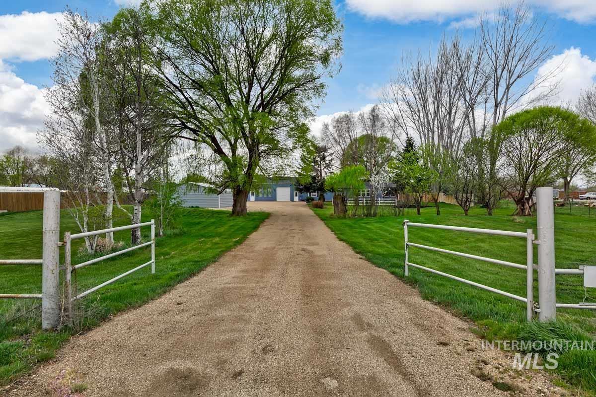 10131 Highway 44 Middleton, ID 83644 - Photo 2 of 42 View of front of property featuring dirt driveway and a view of countryside