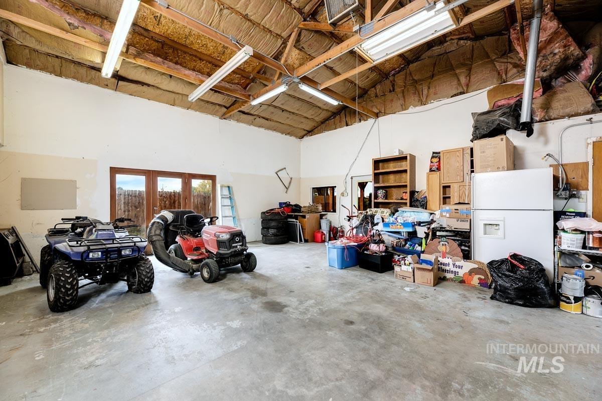10131 Highway 44 Middleton, ID 83644 - Photo 24 of 42 Garage featuring white refrigerator with ice dispenser