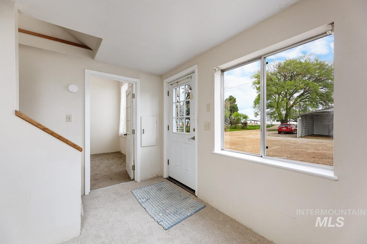 10131 Highway 44 Middleton, ID 83644 - Photo 31 of 42 Entrance foyer with light carpet