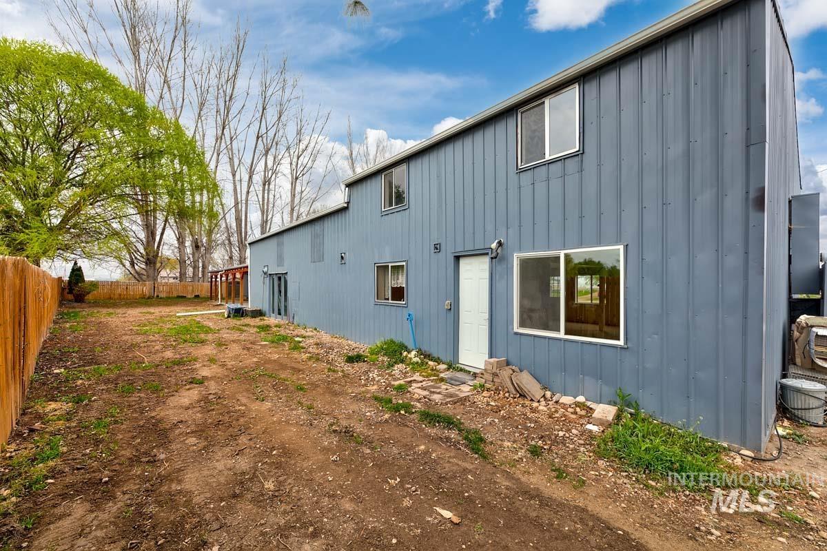 10131 Highway 44 Middleton, ID 83644 - Photo 38 of 42 Rear view of property featuring board and batten siding