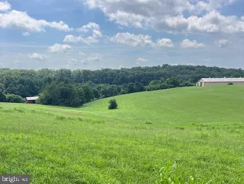 a view of field with ocean view