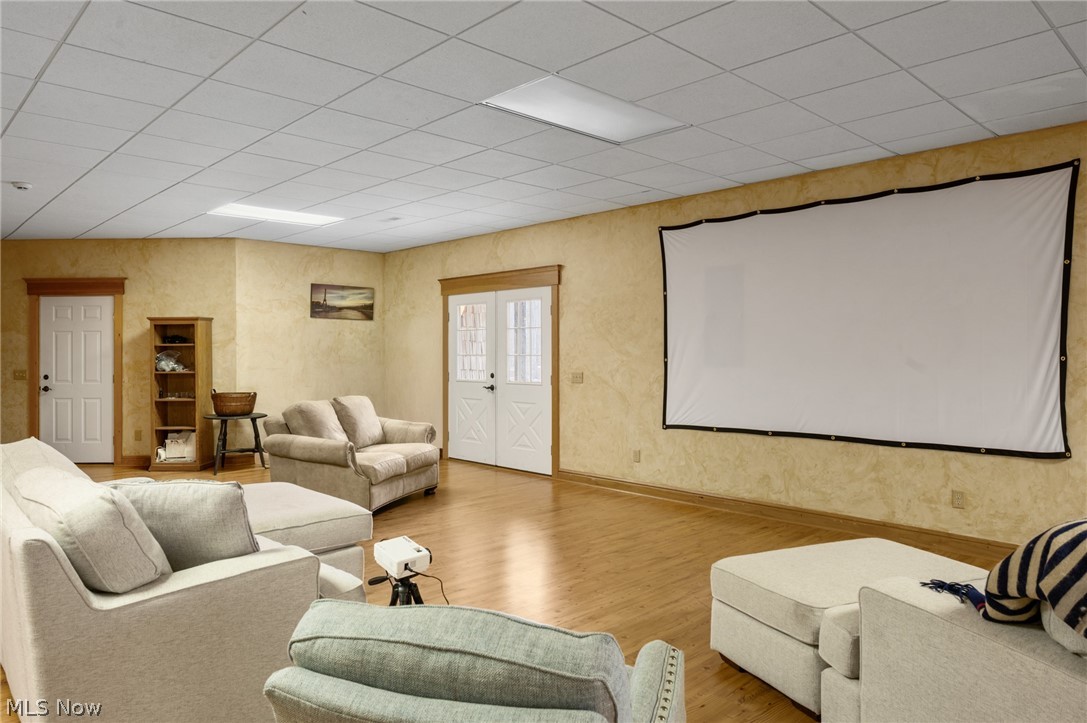 9419 Robinson Road Chardon, OH 44024 - Photo 30 of 46 Home theater featuring light wood-type flooring and a drop ceiling