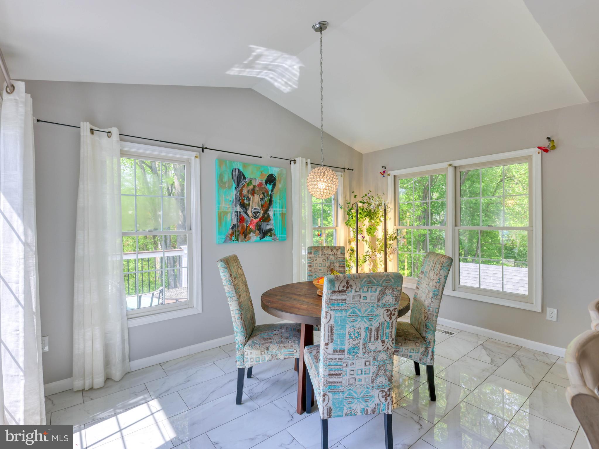 18500 Gingerbread Lane Gaithersburg, MD 20877 - Photo 13 of 56 a view of a dining room with furniture window and outside view