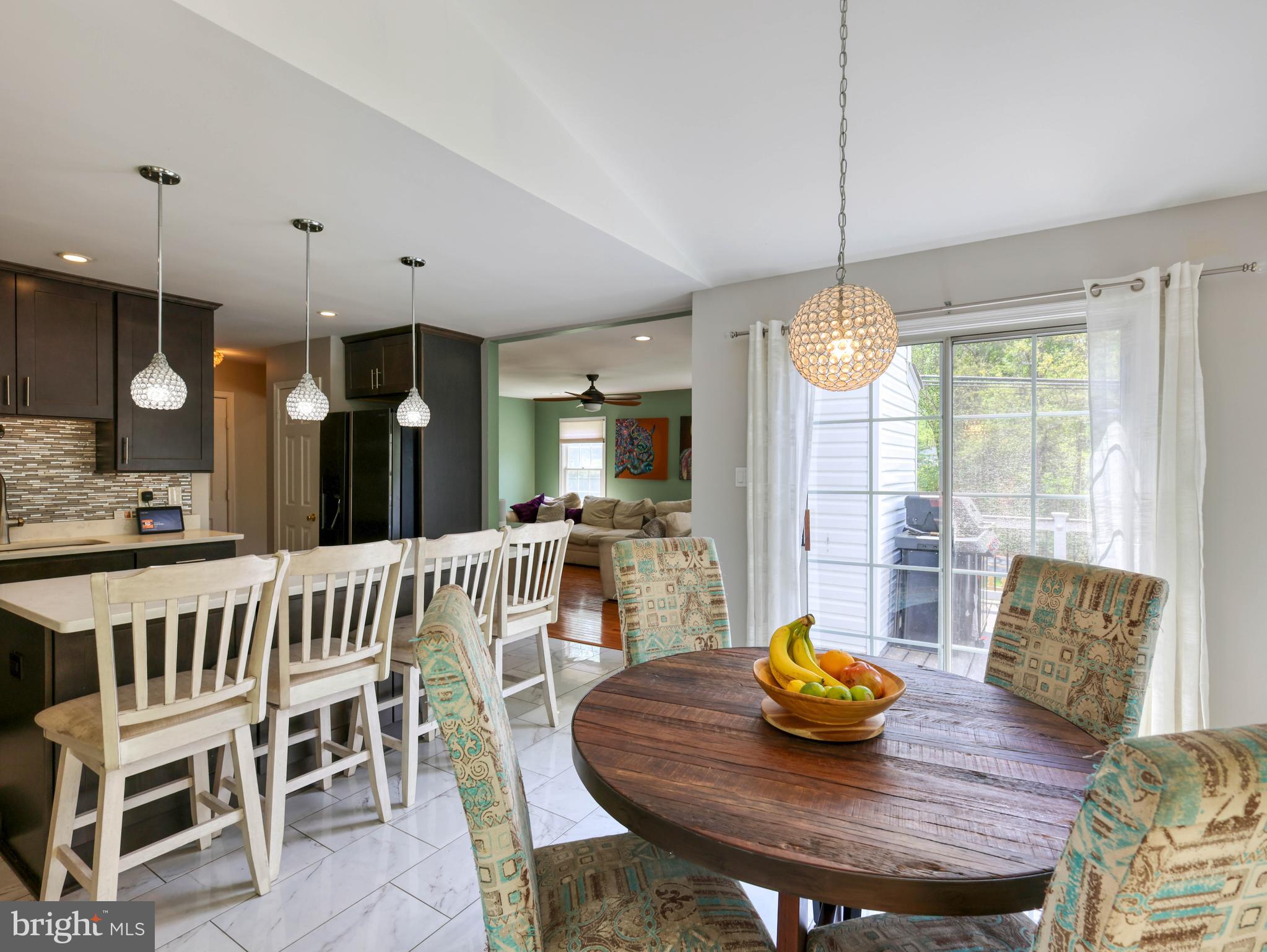 18500 Gingerbread Lane Gaithersburg, MD 20877 - Photo 14 of 56 a view of a dining room with furniture window and wooden floor