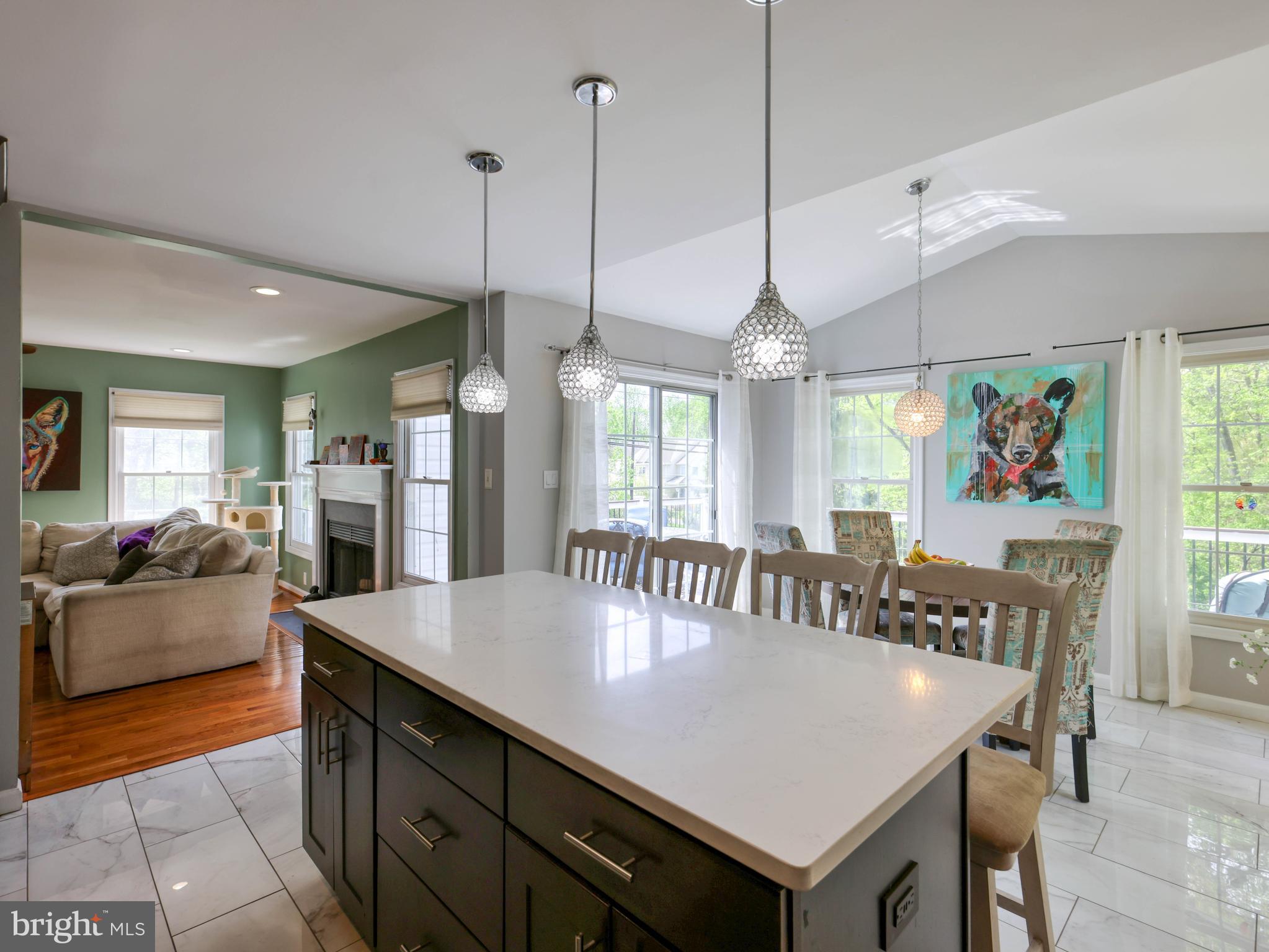 18500 Gingerbread Lane Gaithersburg, MD 20877 - Photo 17 of 56 a view of a dining table chairs and chandelier
