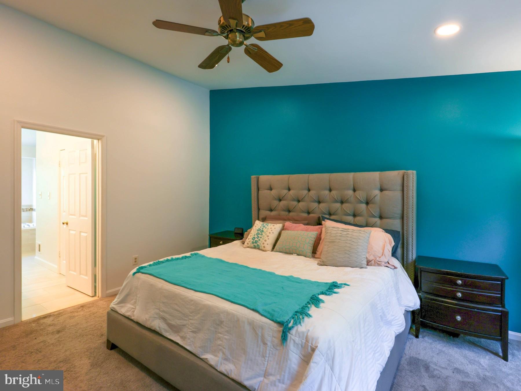 18500 Gingerbread Lane Gaithersburg, MD 20877 - Photo 24 of 56 a bedroom with a bed and a fan
